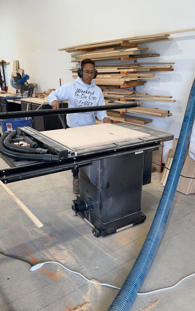 woodworker standing in front of a tablesaw